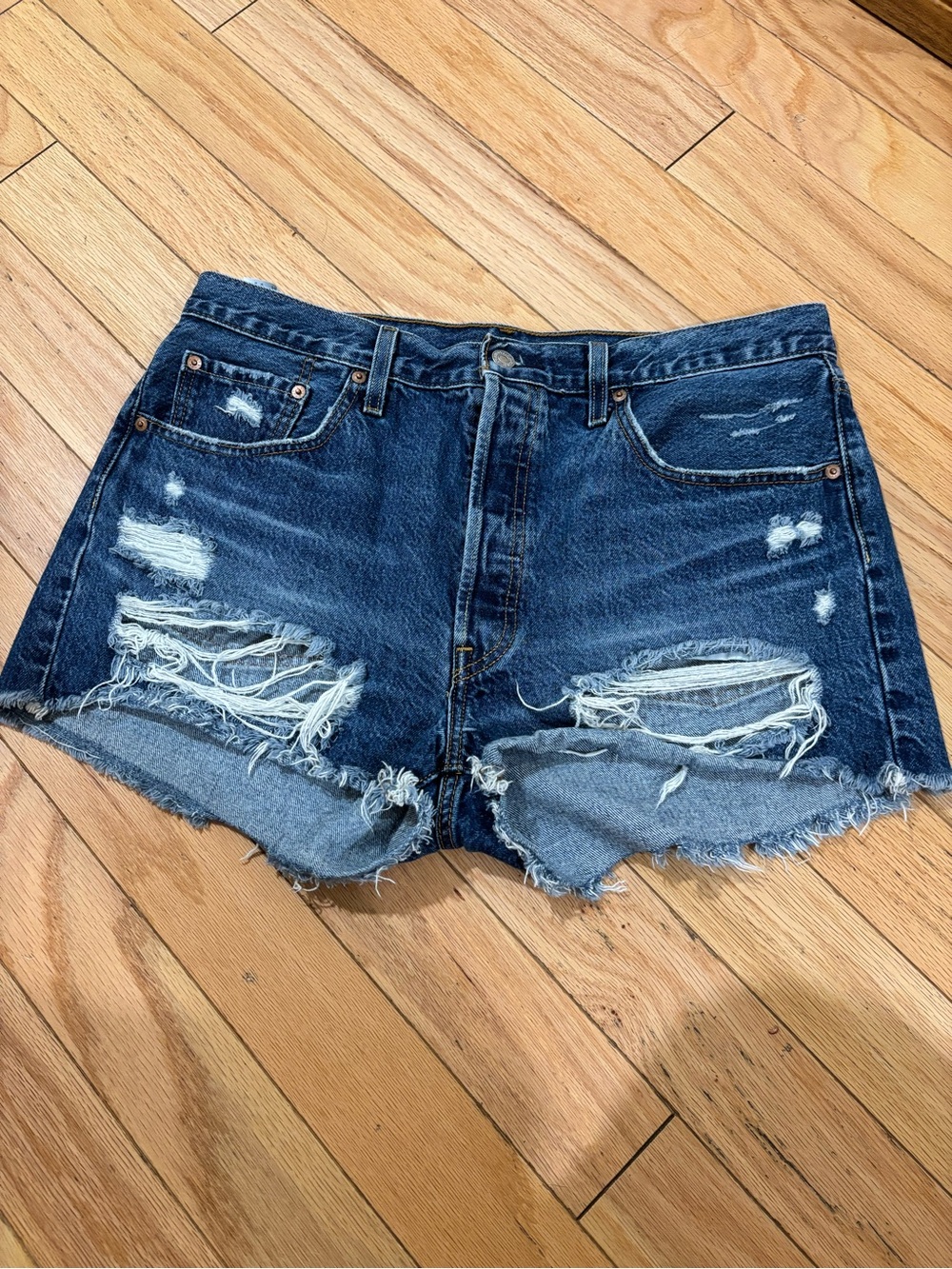 Levi’s 501 Dark Blue Distressed Denim Shorts